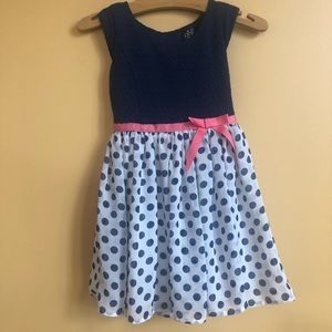 Navy Pot A Dot Sun Dress. Ribbon trimmed. Girls 5